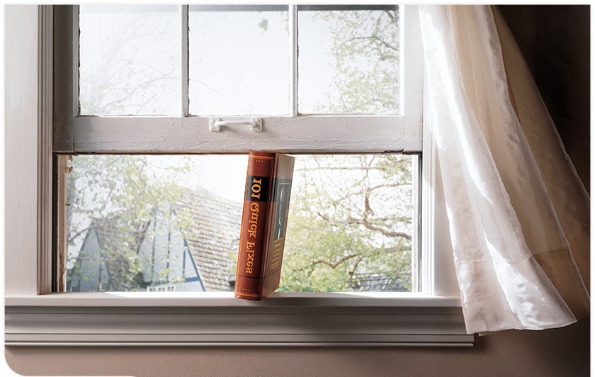 Window propped up by a book